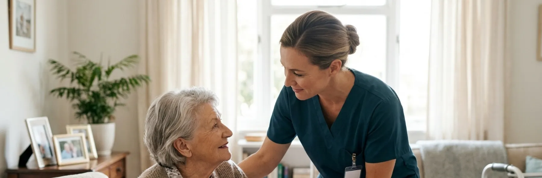 A nurse sharing a warm moment with an older woman